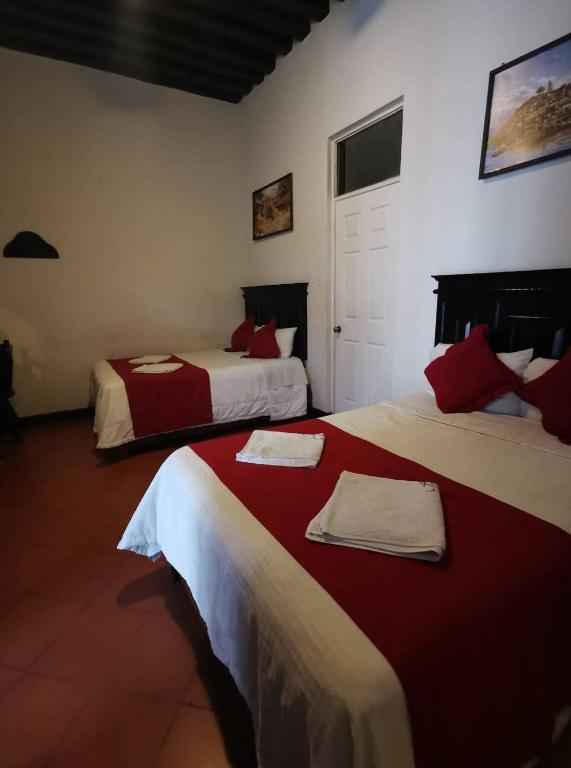 Postel nebo postele na pokoji v ubytování Hotel Colonial
