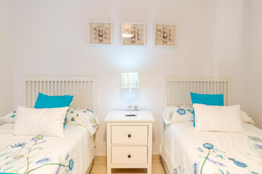 A bed or beds in a room at Victoria 50