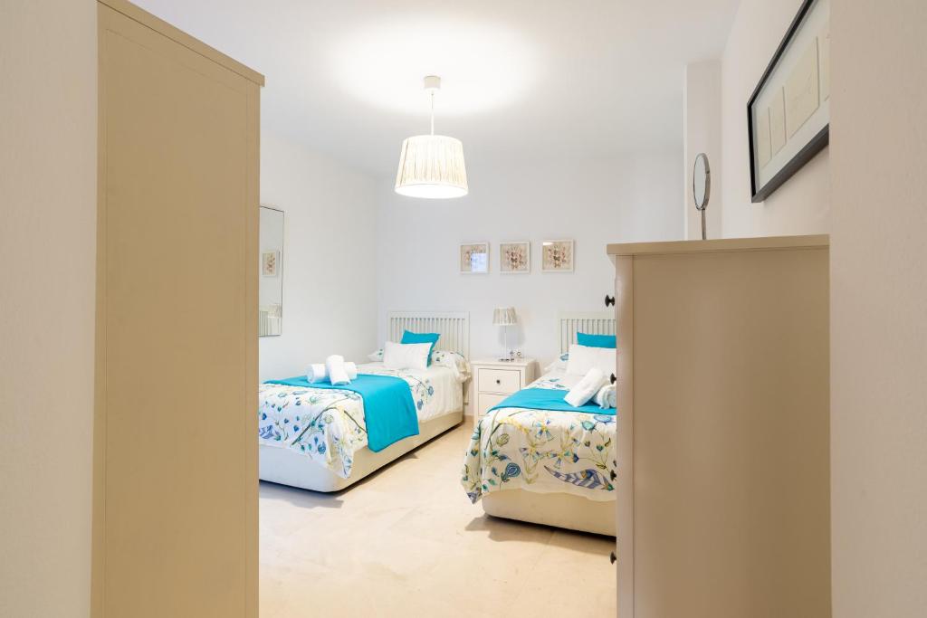 A bed or beds in a room at Victoria 50