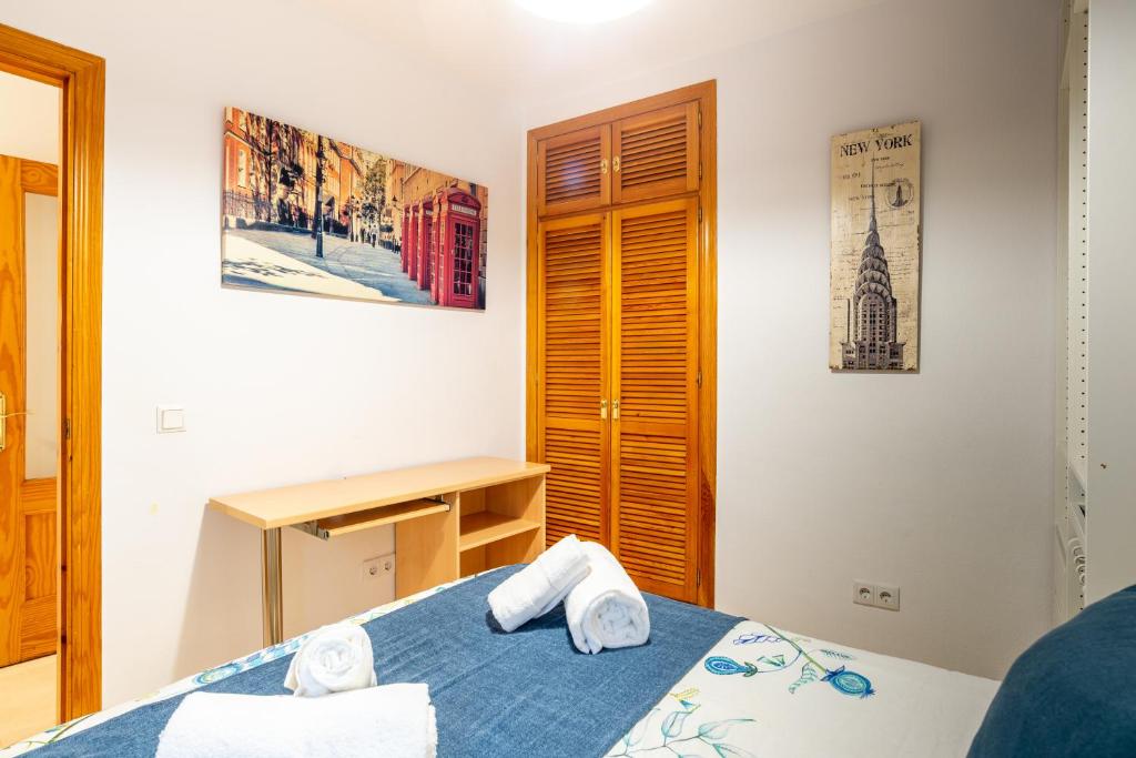 A bed or beds in a room at Victoria 50