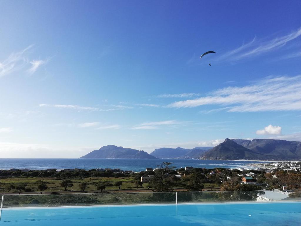 a view of the ocean from a swimming pool at Mountain & Sea Apartments in Kommetjie