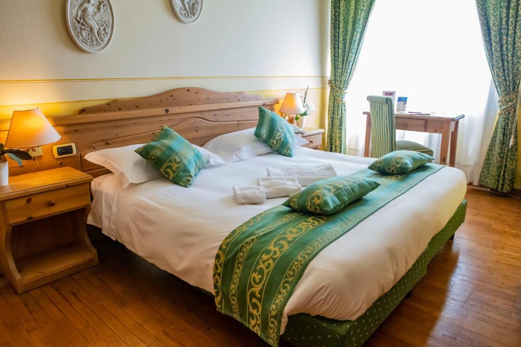 Postel nebo postele na pokoji v ubytování Hotel Villa Imperina