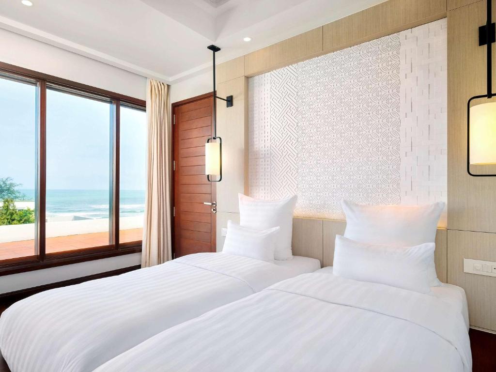 Postel nebo postele na pokoji v ubytování Pullman Danang Beach Resort