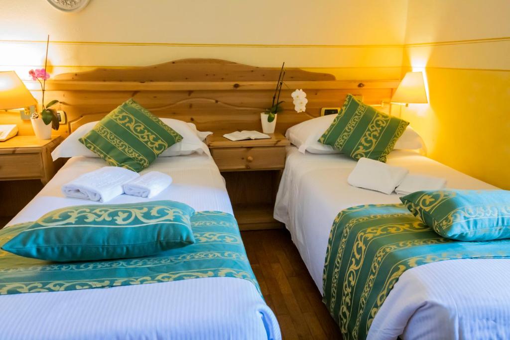 Postel nebo postele na pokoji v ubytování Hotel Villa Imperina