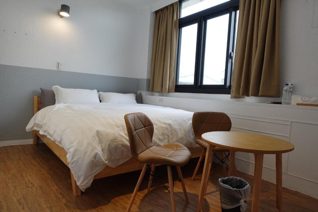 Postel nebo postele na pokoji v ubytování Small Island Homestay