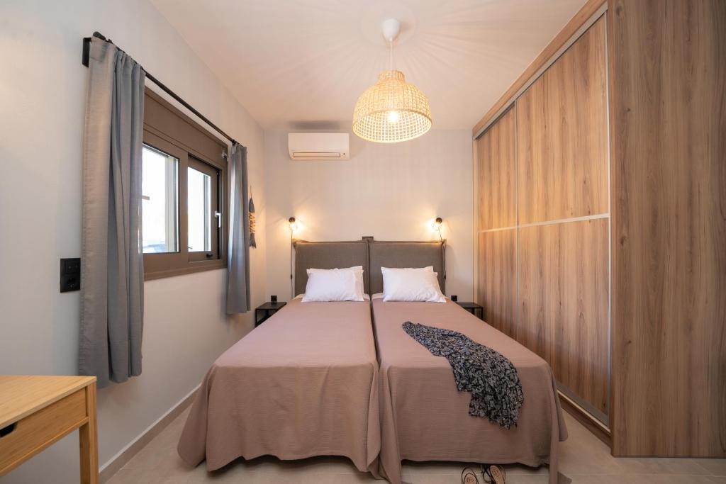 Postel nebo postele na pokoji v ubytování Marianna Villas - Aria -