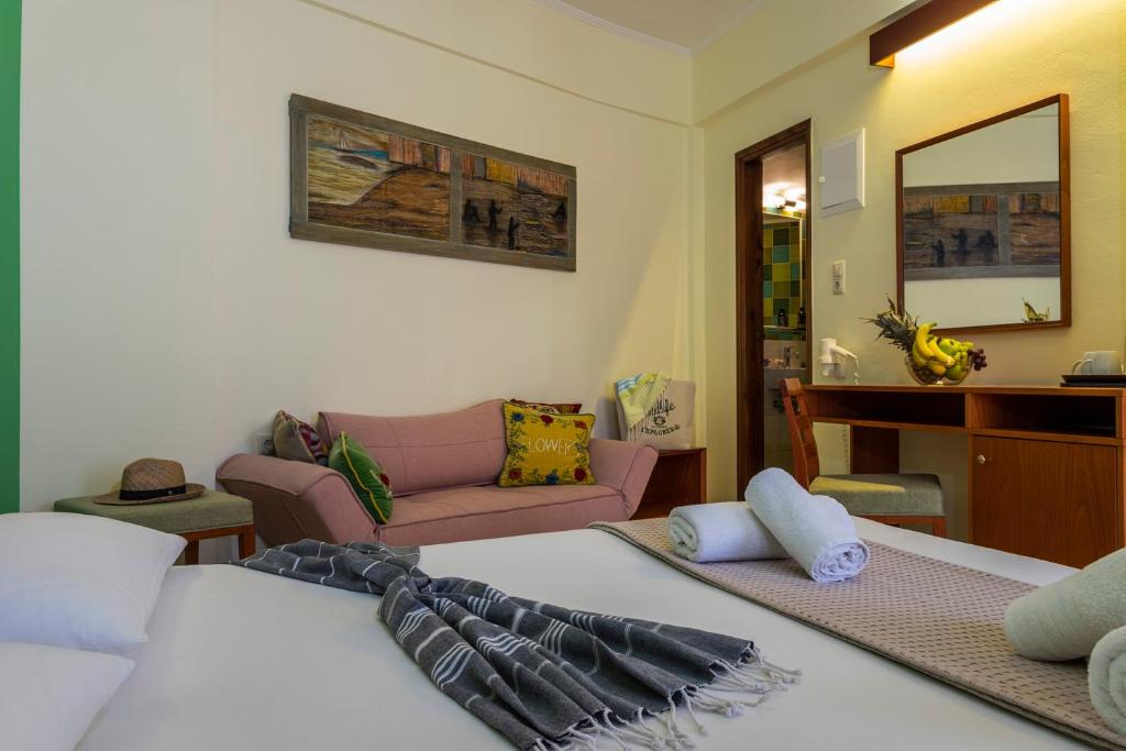 Postel nebo postele na pokoji v ubytování Aris Boutique Hotel