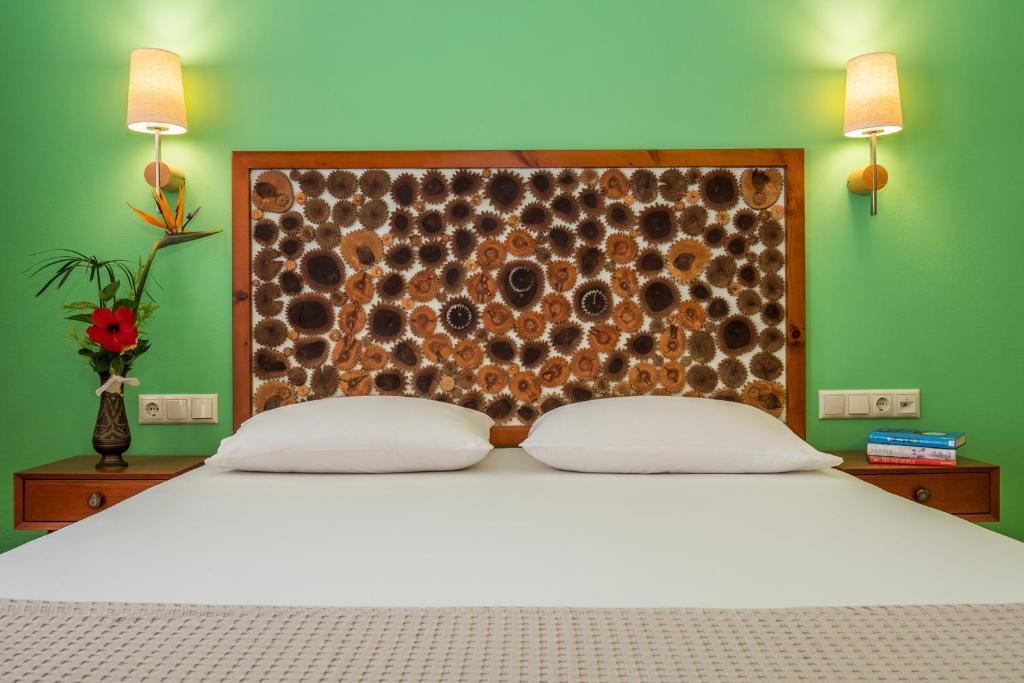 Postel nebo postele na pokoji v ubytování Aris Boutique Hotel