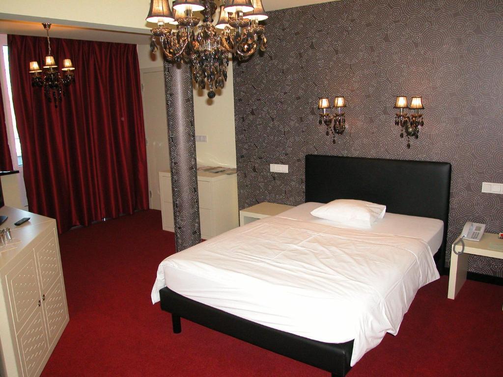 Voodi või voodid majutusasutuse Hotel Olivier toas
