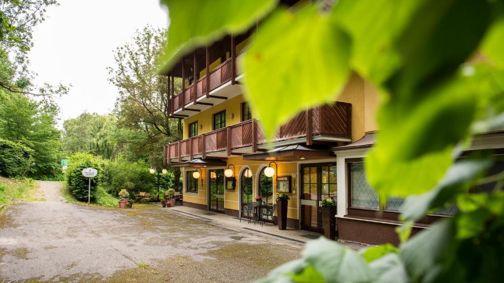 a building with a street in front of it at Parkhotel in Bad Hall