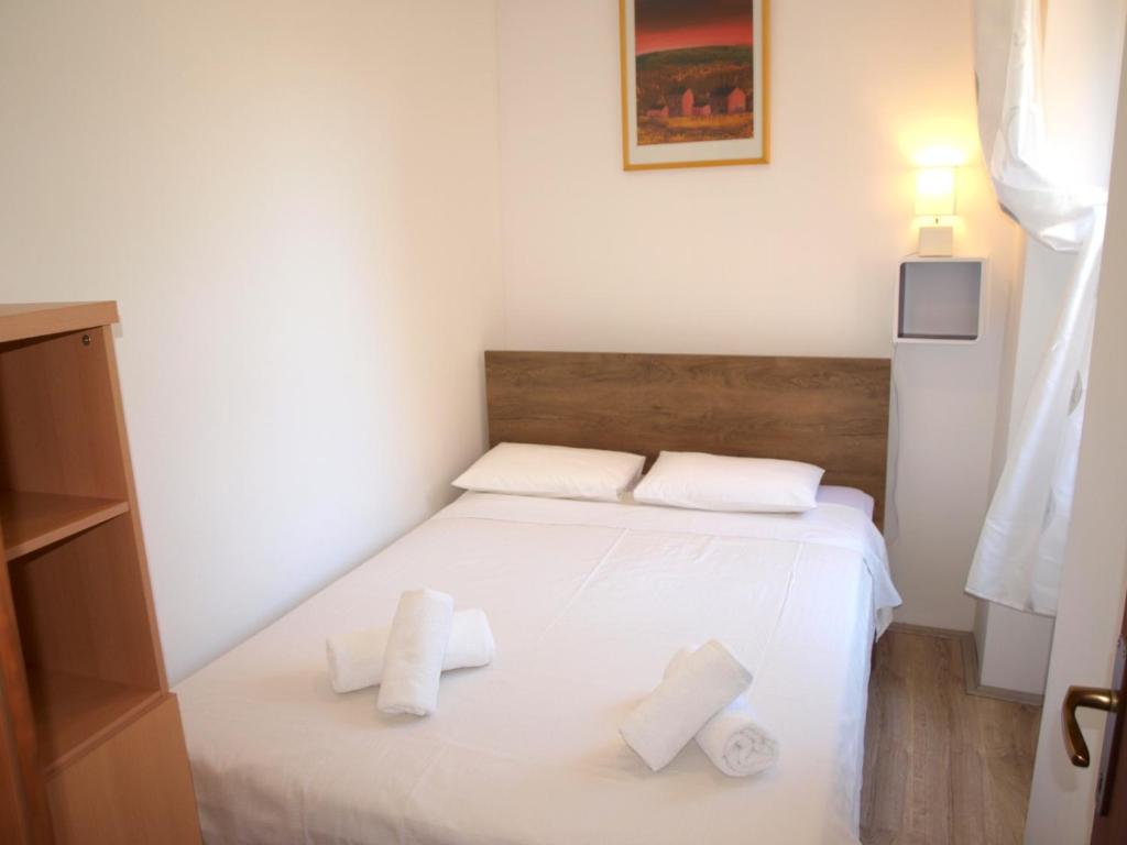 Łóżko lub łóżka w pokoju w obiekcie Apartment MONTE