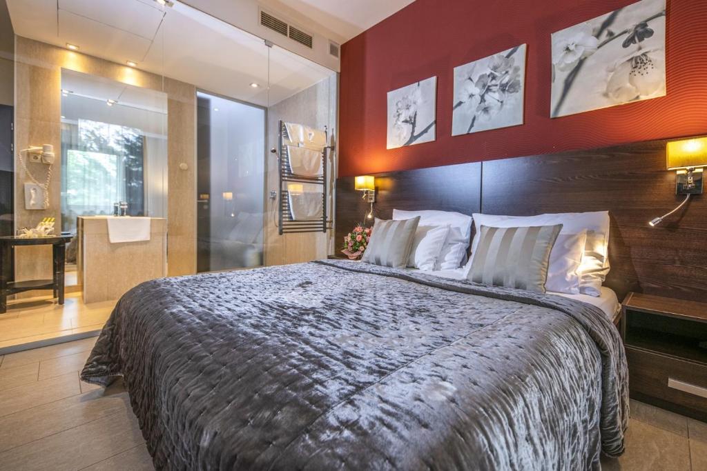 Postel nebo postele na pokoji v ubytování Budapest Airport Hotel Stáció Wellness & Konferencia