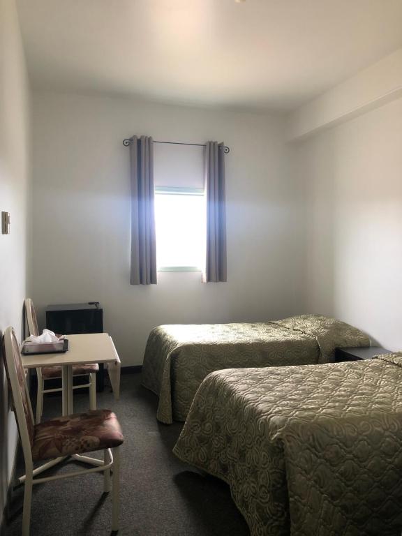 Postel nebo postele na pokoji v ubytování IceBerg Inn