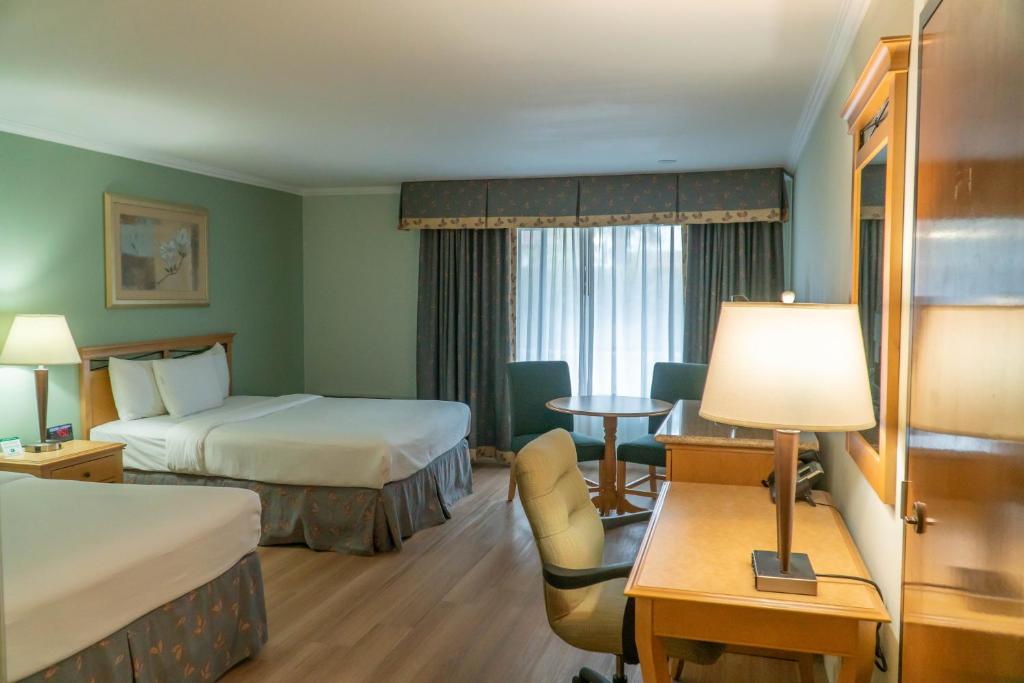 Postel nebo postele na pokoji v ubytování Hotel Piccadilly
