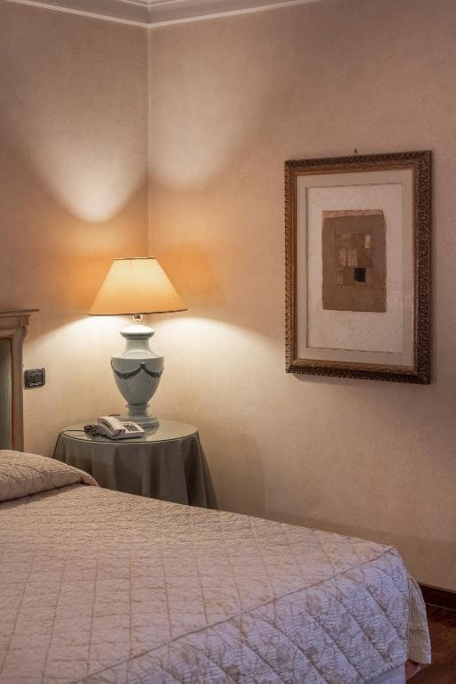 Postel nebo postele na pokoji v ubytování Relais Ducale