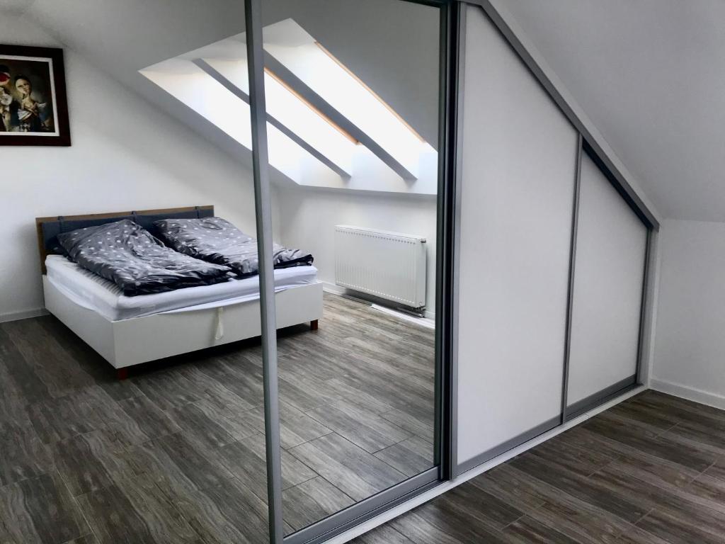 Posteľ alebo postele v izbe v ubytovaní Apartament Julia