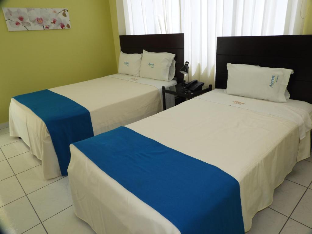 Postel nebo postele na pokoji v ubytování Arenas Hotel & Spa
