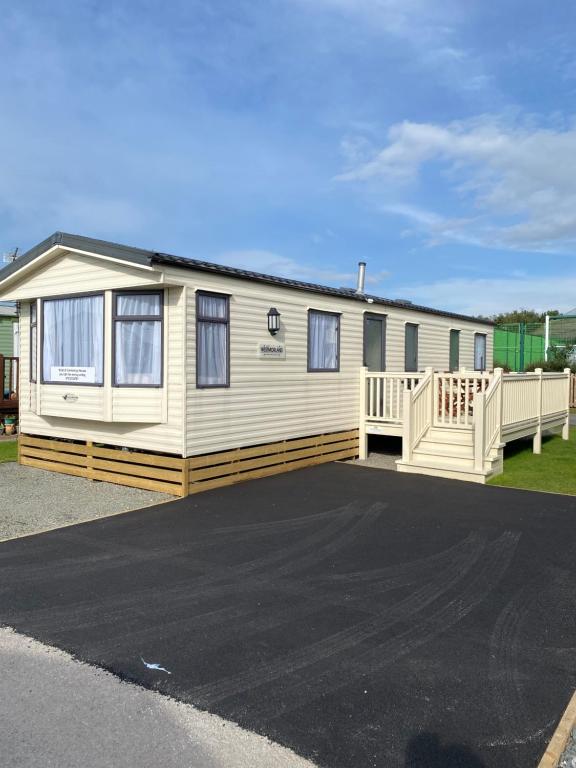 a mobile home with a driveway in front of it at Nicks & Carmels by the sea in Heysham