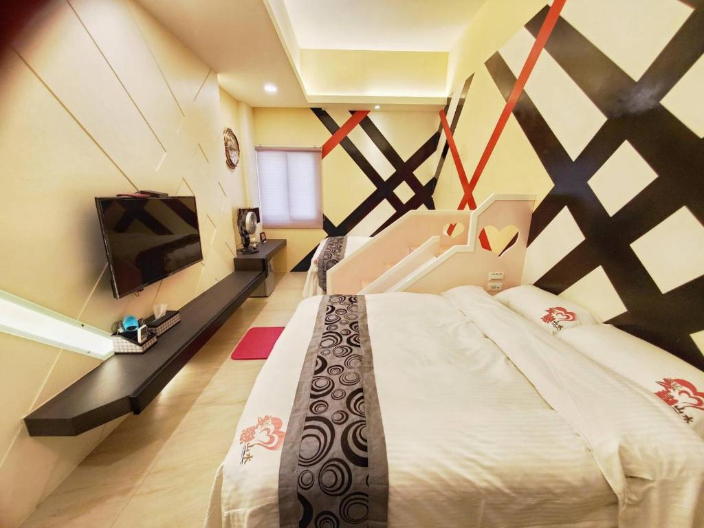 Postel nebo postele na pokoji v ubytování Ai Lian Shan Shui Homestay