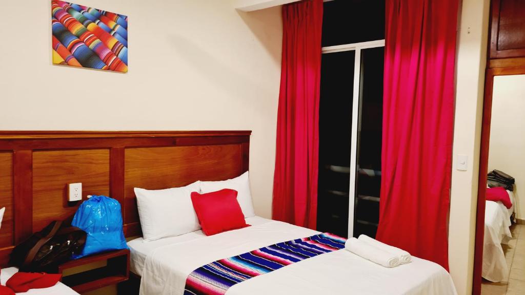 Postel nebo postele na pokoji v ubytování Hotel Machos Mahahual