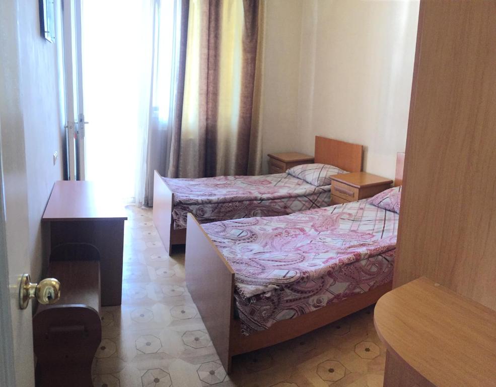Postel nebo postele na pokoji v ubytování Guest House Lilia