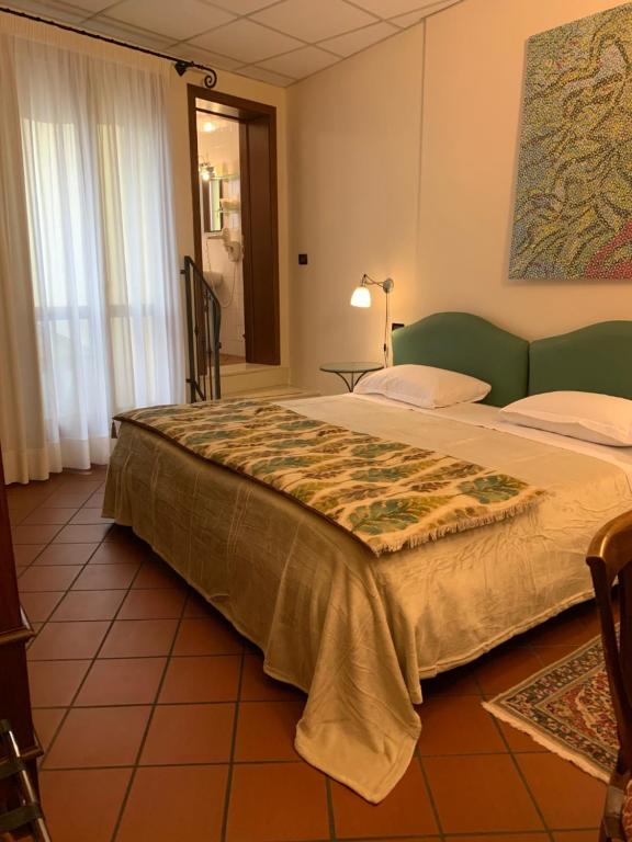 Postel nebo postele na pokoji v ubytování Hotel De Prati