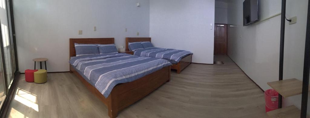 Postel nebo postele na pokoji v ubytování 瑞恒行館Reui Heng Guesthouse