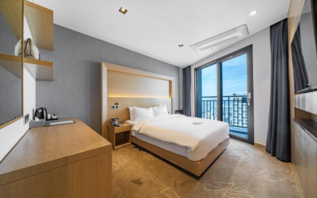 Postel nebo postele na pokoji v ubytování Sea Cruise Hotel