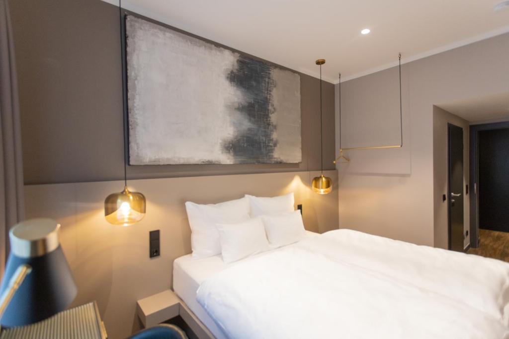 Postel nebo postele na pokoji v ubytování Munich Rooms Hotel