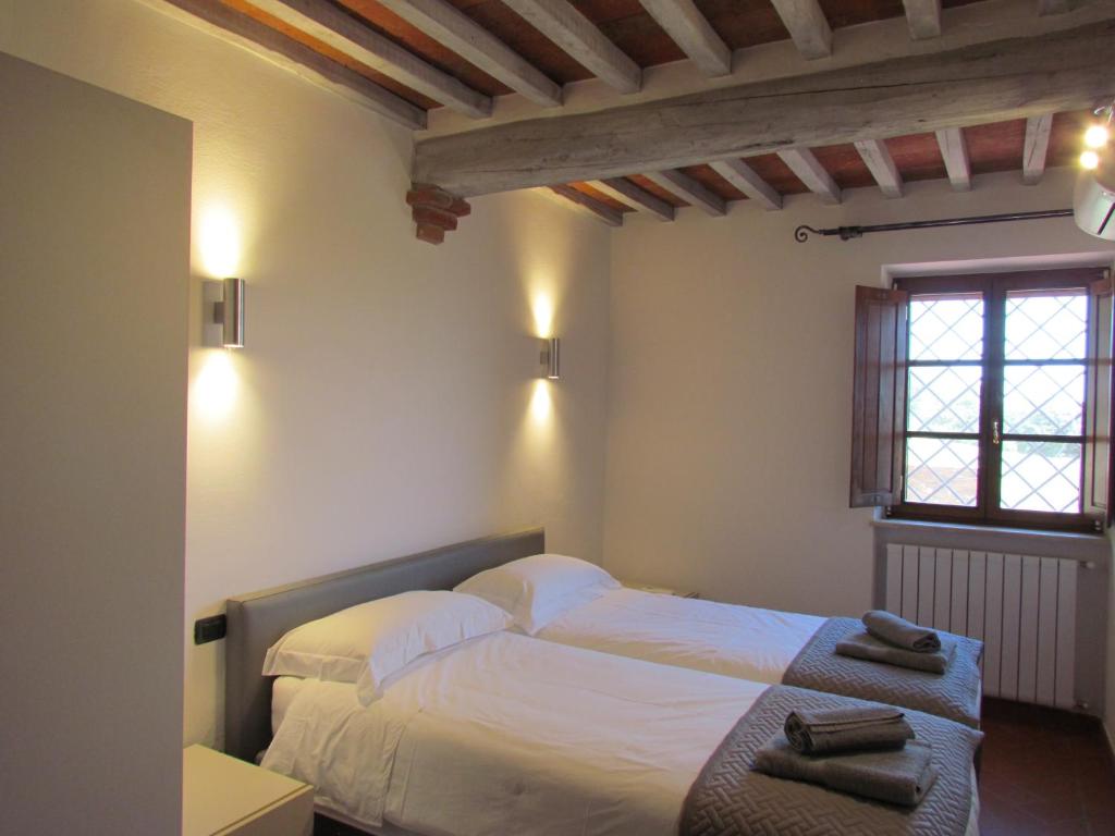 Postel nebo postele na pokoji v ubytování Podere La Casa