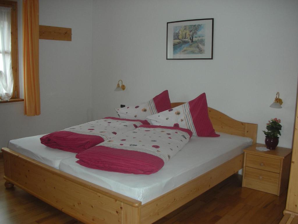 A bed or beds in a room at Gasthaus St. Valentin