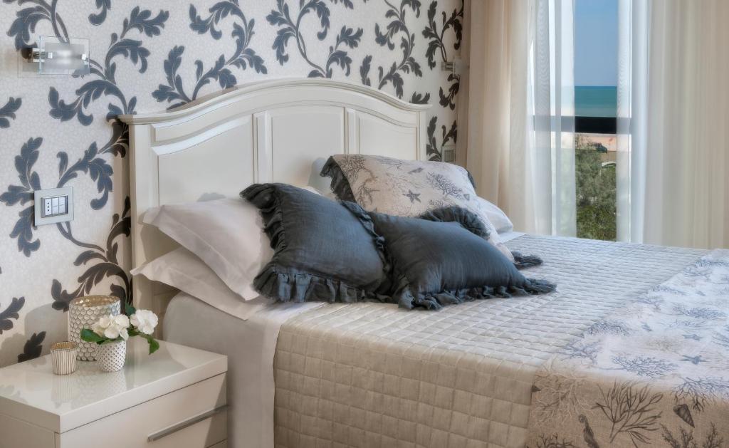 Postel nebo postele na pokoji v ubytování Hotel Vistamare