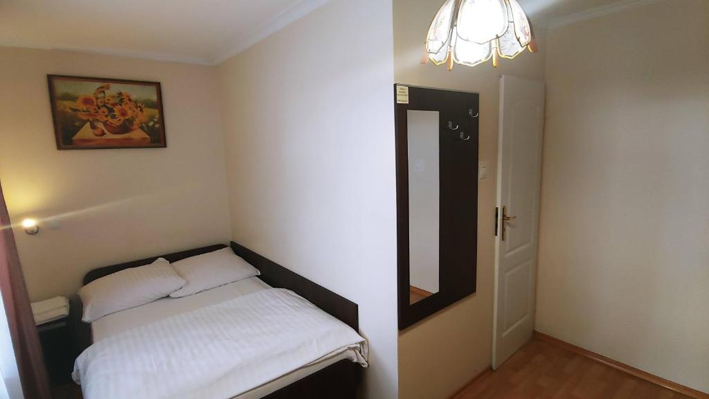 Postel nebo postele na pokoji v ubytování Hotel E7