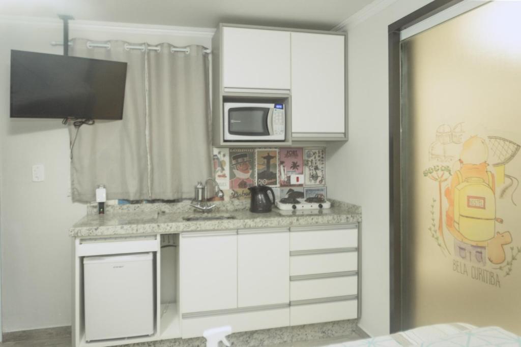 Kuchyň nebo kuchyňský kout v ubytování Bela Curitiba Hostel