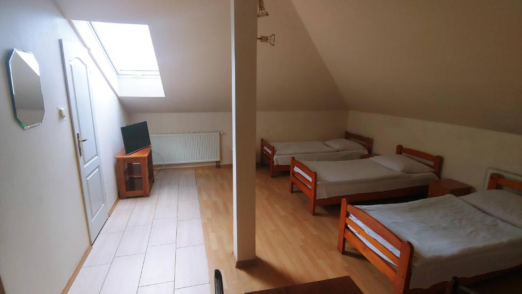 Postel nebo postele na pokoji v ubytování Hotel E7
