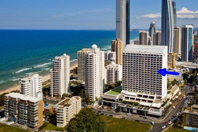 a view of a city with a building with a blue arrow at Surfers Ocean View Sleeps 4, Free WIFI, Washing Machine, Large Fridge in Gold Coast