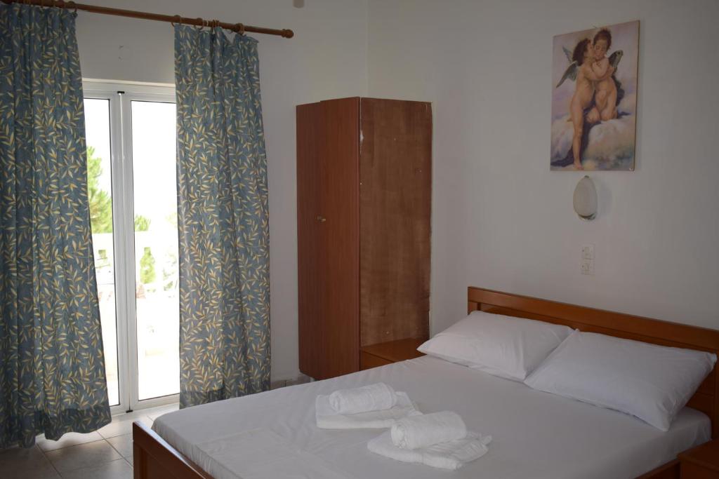 Postel nebo postele na pokoji v ubytování Red Sun Apartments