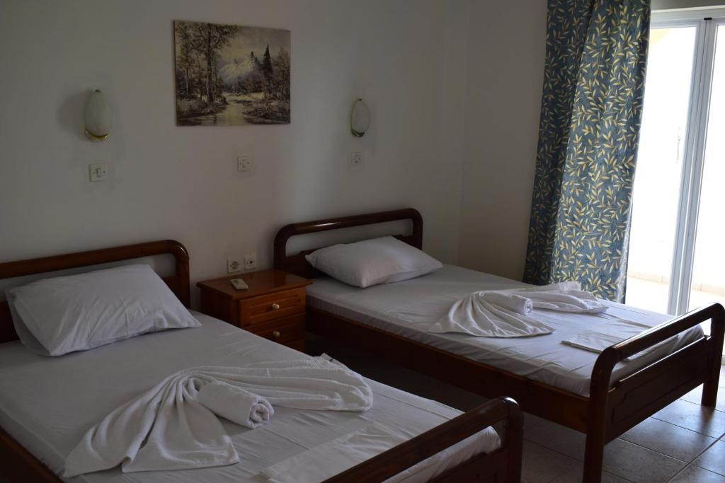 Postel nebo postele na pokoji v ubytování Red Sun Apartments