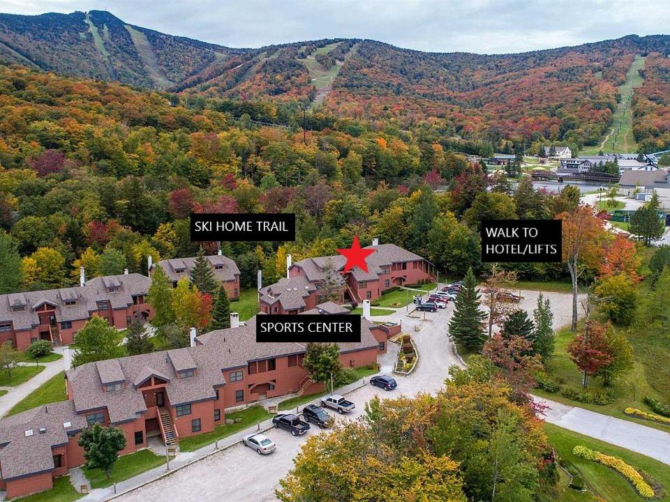 an aerial view of a house with mountains in the background at Trail Creek: Walk to lifts, ski home! Closest unit to lifts, ski home trail, sports center in Killington