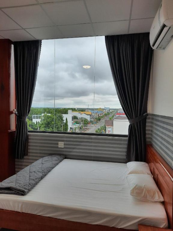 Postel nebo postele na pokoji v ubytování Hotel Sen Việt Bạc Liêu