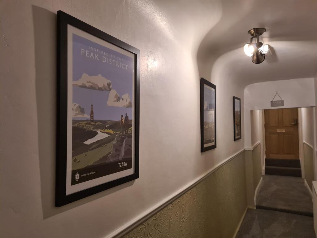 a hallway with a framed picture on the wall at Derwentwater Arms in Curbar