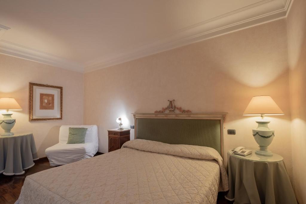 Postel nebo postele na pokoji v ubytování Relais Ducale