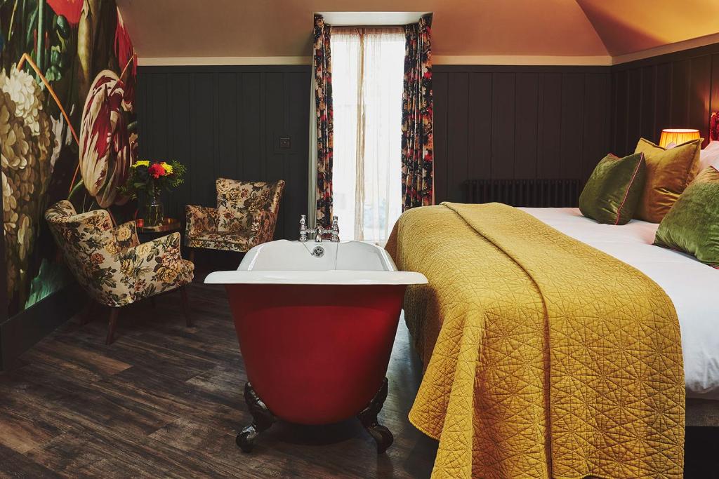 a hotel room with a bed and a white sink at No.26 By The Sea in Oban