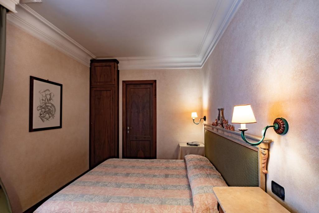 Postel nebo postele na pokoji v ubytování Relais Ducale