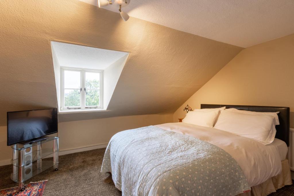 Postel nebo postele na pokoji v ubytování Hubert House