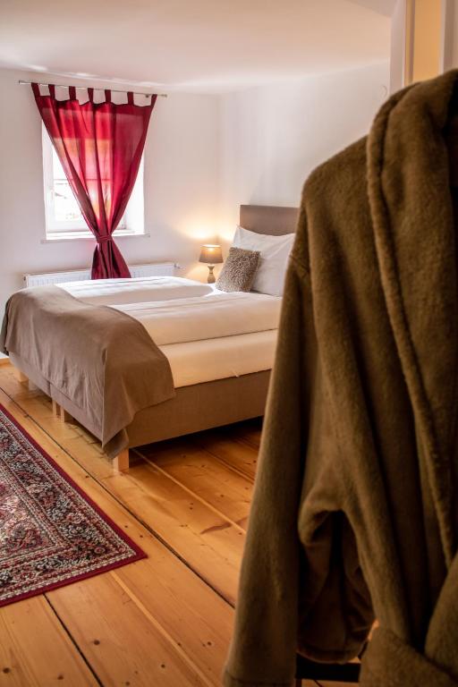 Una cama o camas en una habitación de Fenix Hall Boutique Hotel Hallstatt