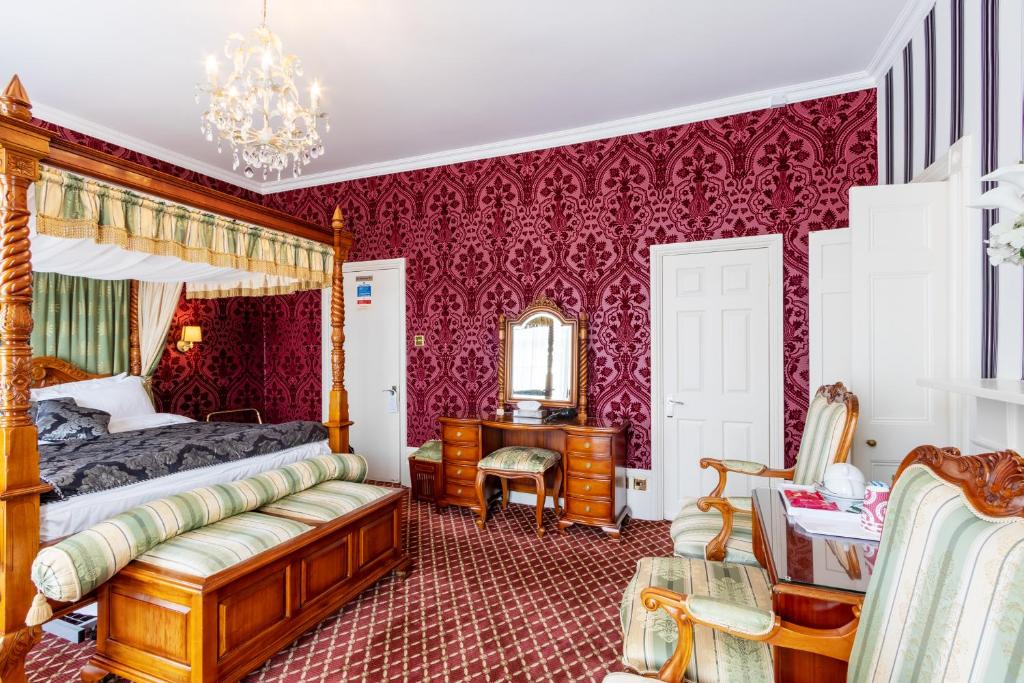 Postel nebo postele na pokoji v ubytování Hubert House