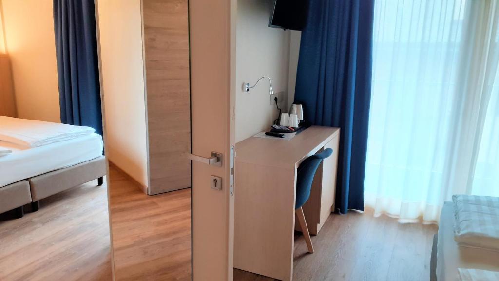 Postel nebo postele na pokoji v ubytování Livì Family Hotel