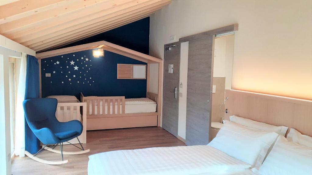 Postel nebo postele na pokoji v ubytování Livì Family Hotel