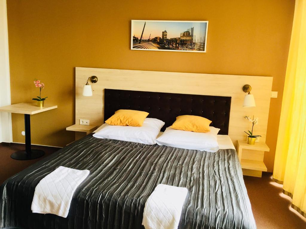 Postel nebo postele na pokoji v ubytování Hotel Denbu